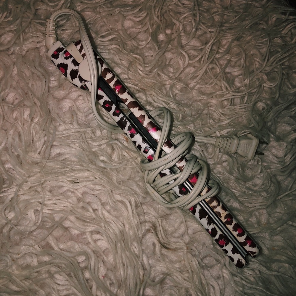 Pink cheetah print hair straightener.